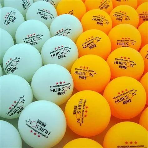 What is the difference between orange and white ping pong balls