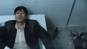 What was sang-woo doing in the bathtub squid game?