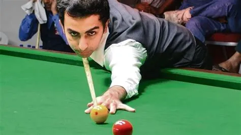 Who is the only indian to have won both the billiards as well as the snooker world title