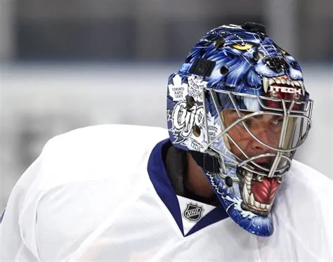 Can a goalie wear a helmet